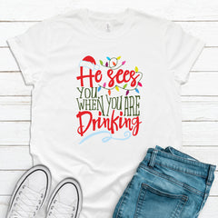CHRISTMAS Unisex Adult's 'He Sees You When You Are Drinking' T-Shirt